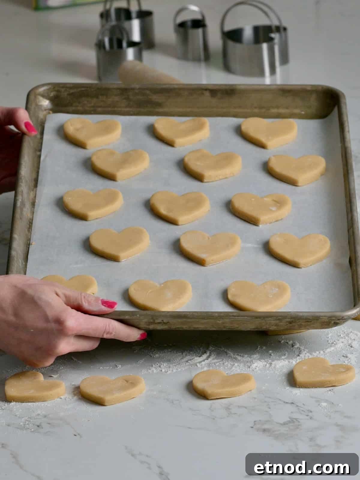 Valentine Sugar Cookies with Creamy Buttercream Frosting 7 A cookie sheet with thick cutout sugar cookie hearts.