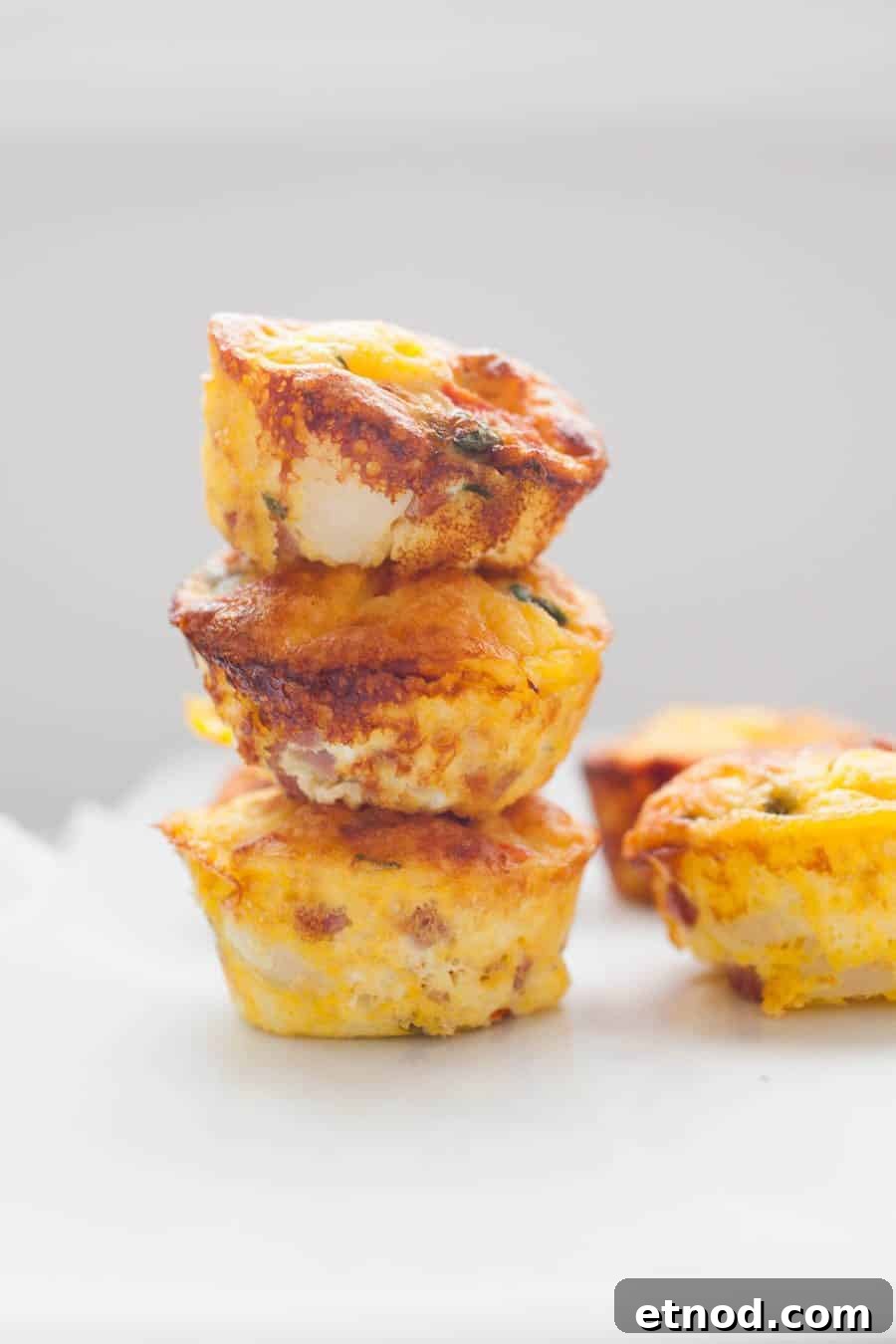 a stack of egg muffins on a countertop.