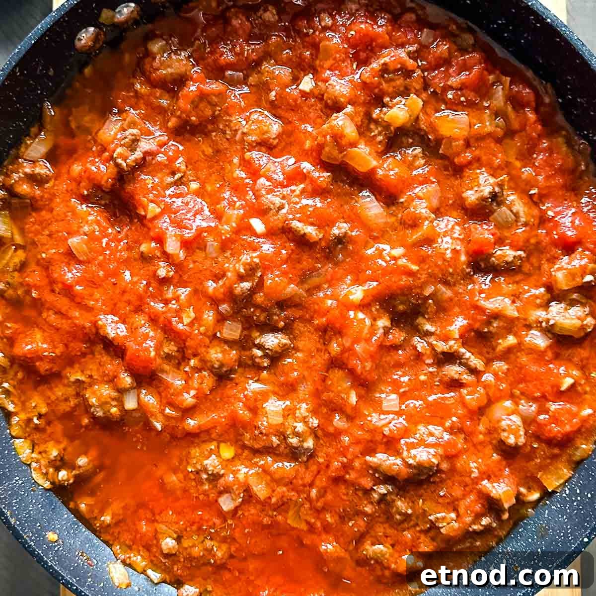 lamb ragu in a gray pan.