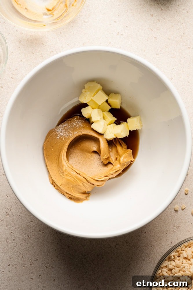 A bowl of peanut butter, butter, salt, and vanilla.