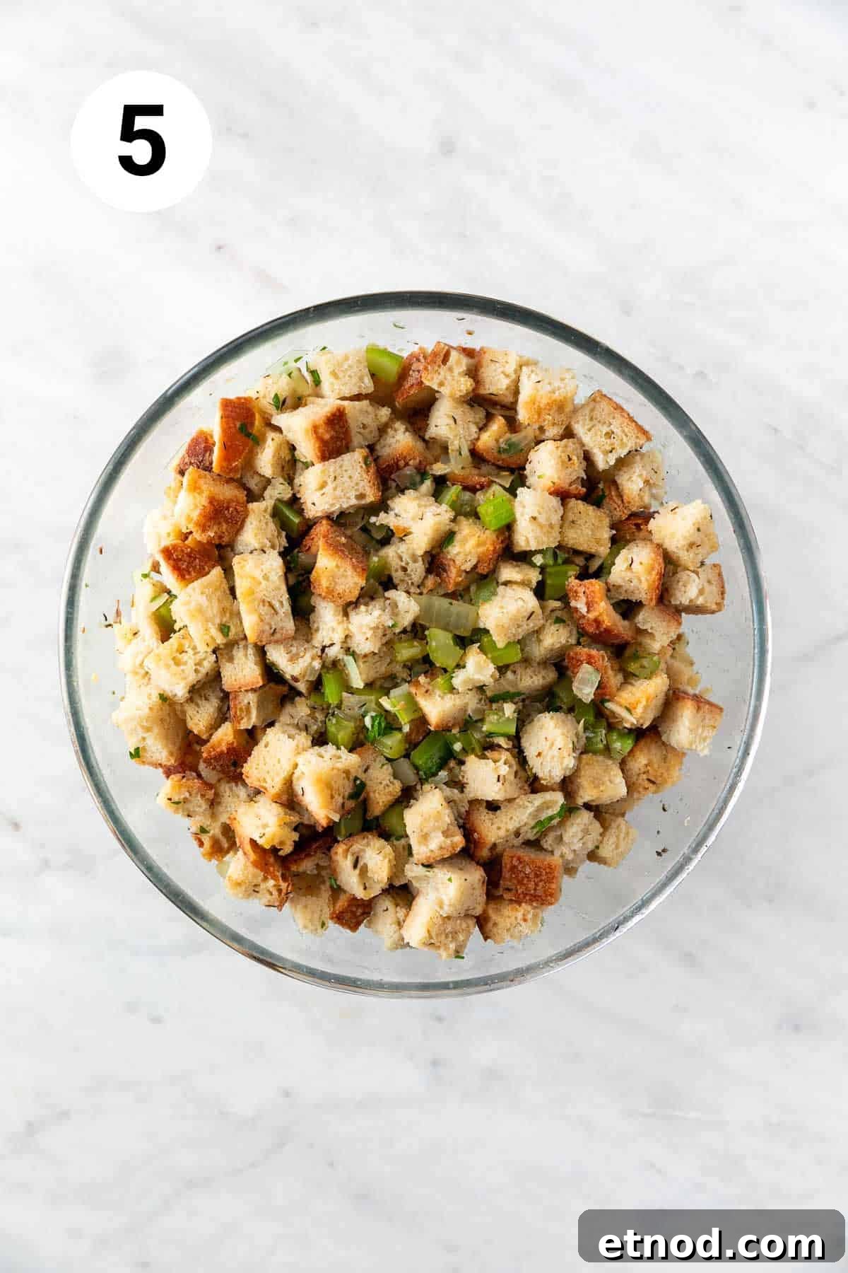 Vegan stuffing in a bowl before baking.