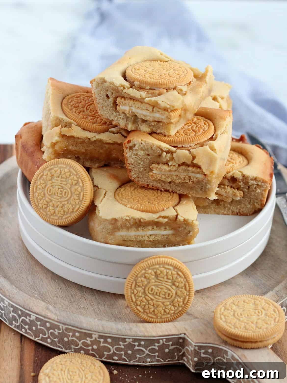 Golden Oreo Blondies Recipe: Chewy Vanilla Oreo Blondies 2 Pile of Oreo blondies on white plates