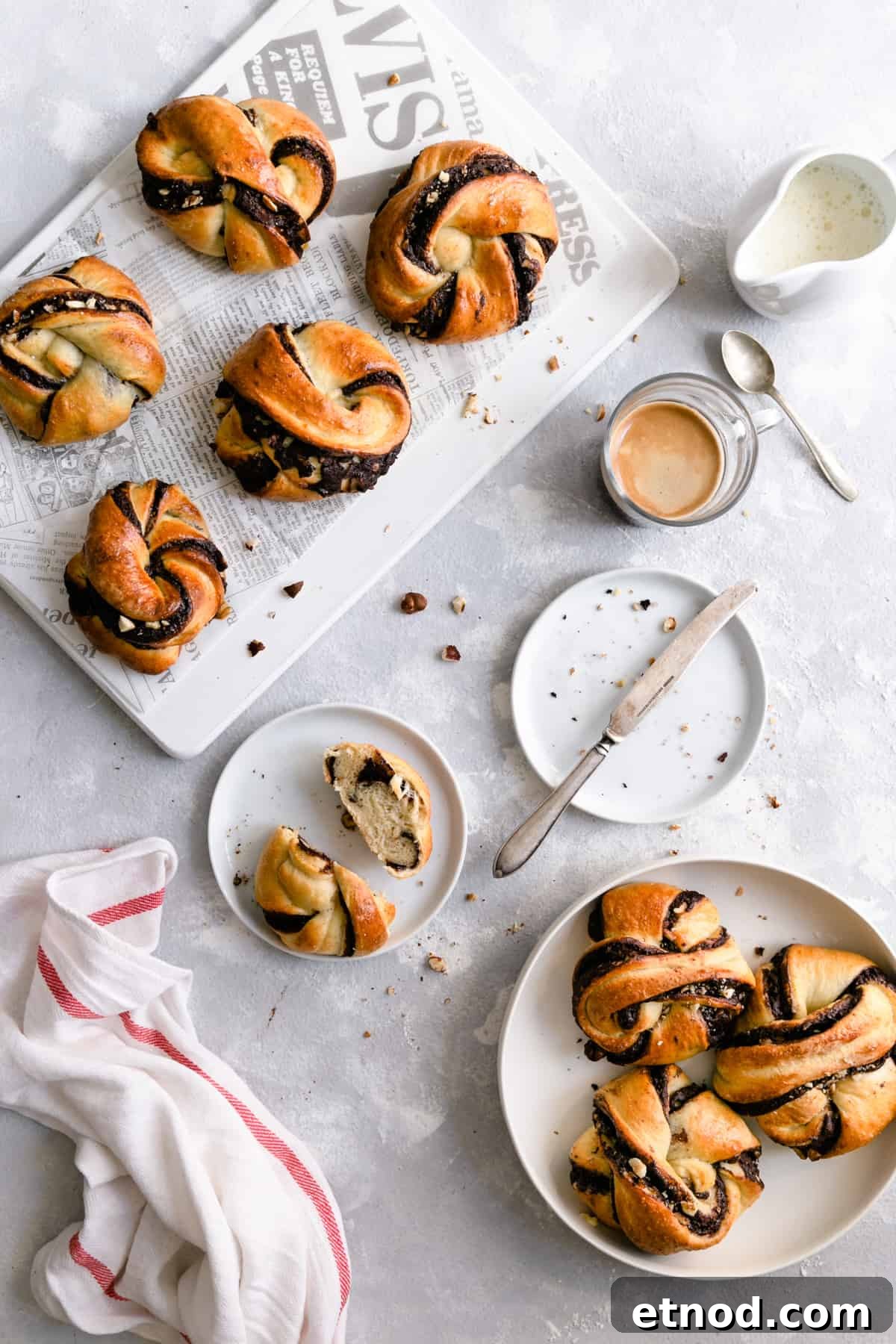 Chocolate Hazelnut Babka Buns Recipe with Gooey Swirls 9 Overhead shot of chocolate hazelnut babka buns with small cup of coffee on side
