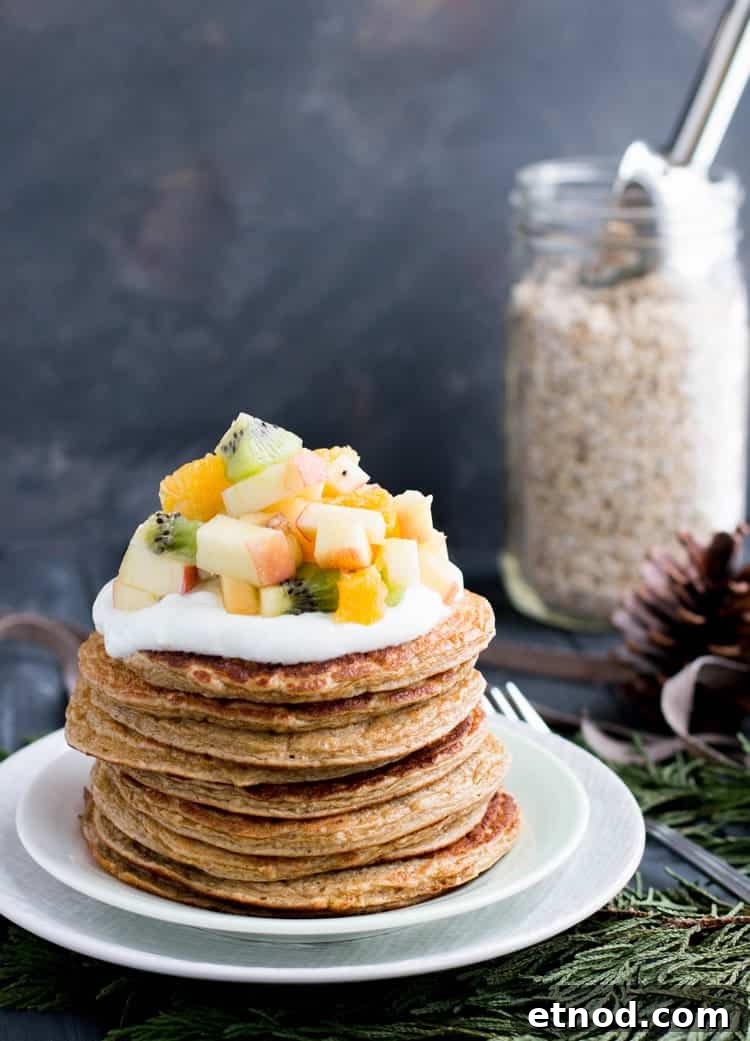 Protein-Packed Oatmeal & Cottage Cheese Pancakes for Muscle Fuel 2 Oatmeal Cottage Cheese Protein Pancakes on a plate topped with mixed from themerchantbaker.com