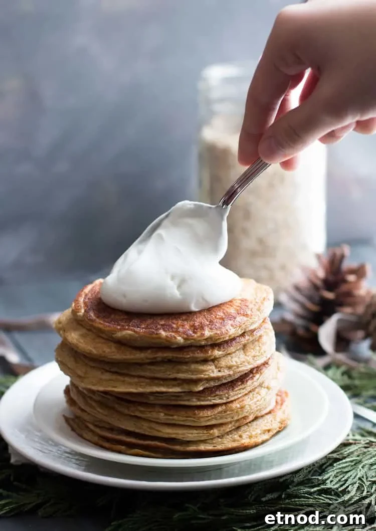 Protein-Packed Oatmeal & Cottage Cheese Pancakes for Muscle Fuel 8 Topping Oatmeal Cottage Cheese Protein Pancakes with whipped cream from themerchantbaker.com