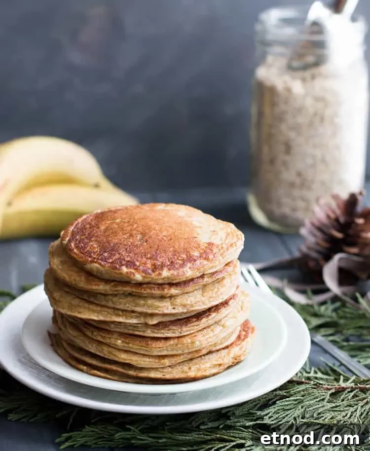 Protein-Packed Oatmeal & Cottage Cheese Pancakes for Muscle Fuel 4 Oatmeal Cottage Cheese Protein Pancakes on a plate from themerchantbaker.com