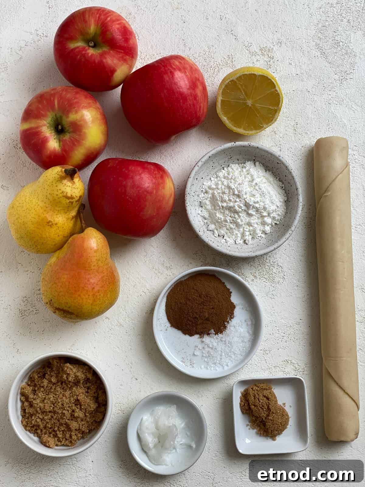Apple and Pear Pie Recipe with Cinnamon Crumble 3 ingredients for Easy Apple Pear Pie measured out against a white surface