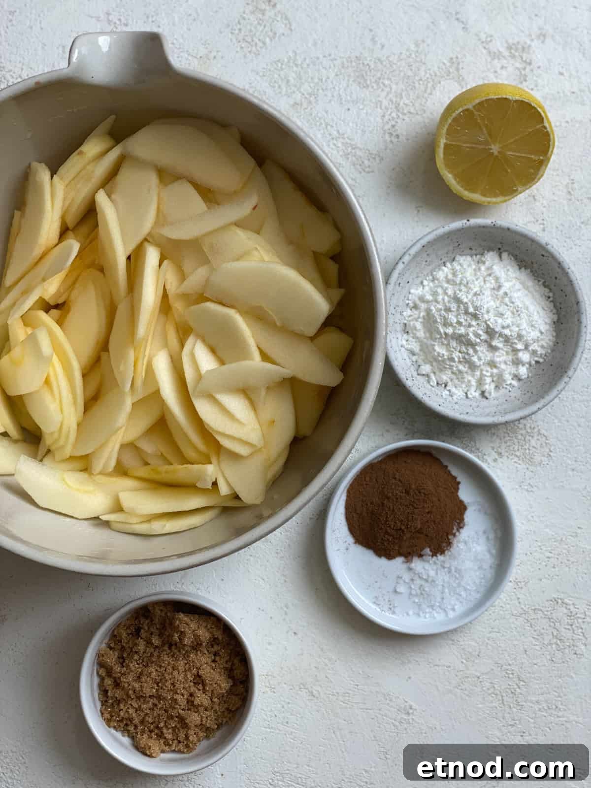 Apple and Pear Pie Recipe with Cinnamon Crumble 4 ingredients for Easy Apple Pear Pie measured out against a white surface
