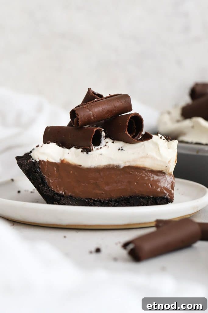 Decadent Peanut Butter Pie (Gluten-Free Recipe) 12 a slice of gluten-free chocolate cream pie topped with whipped cream and chocolate curls