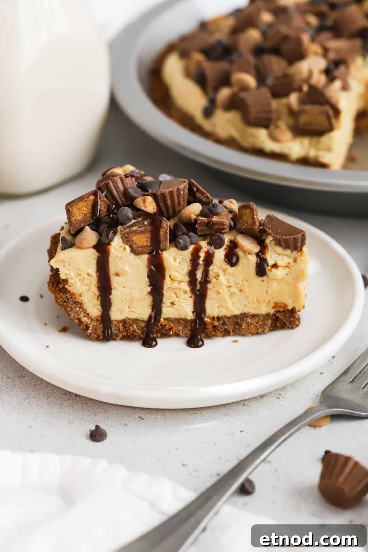 Decadent Peanut Butter Pie (Gluten-Free Recipe) 14 a slice of gluten-free peanut butter pie on a white dessert plate