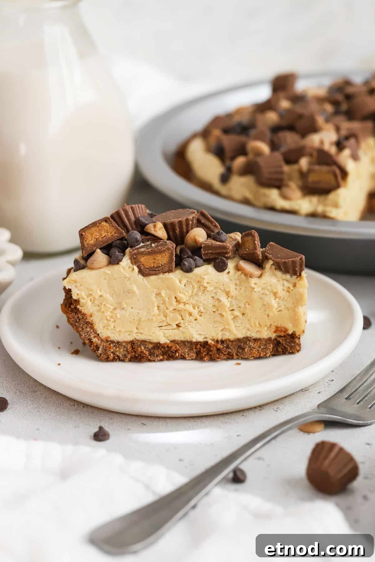 Decadent Peanut Butter Pie (Gluten-Free Recipe) 7 a slice of gluten-free peanut butter pie on a white dessert plate