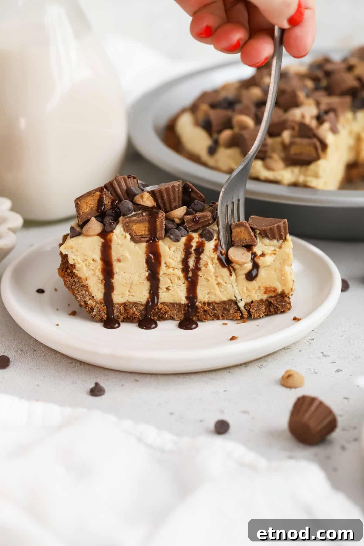 Decadent Peanut Butter Pie (Gluten-Free Recipe) 9 fork taking a bite out of a slice of gluten-free peanut butter pie