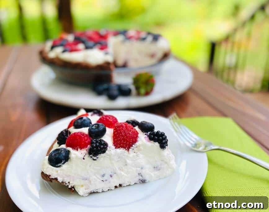 Mixed Berry Cream Chocolate Pie Recipe 5 Slice of pie on a plate with a fork.