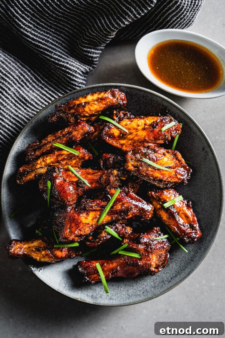 Smoky Maple Bourbon Chicken Wings Recipe for Crowd-Pleasing Flavor 3 smoky maple bourbon chicken wings on plate horizontal