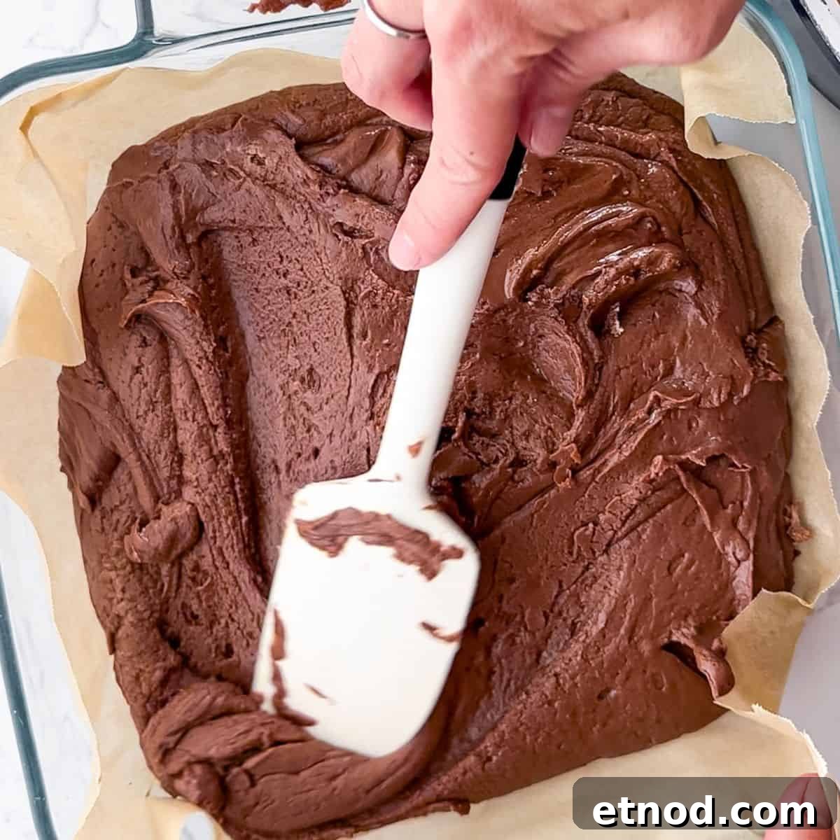 Whimsical Fantasy Fudge Recipe for Magical Flavor 7 Placing the fudge mixture into a 9x9 pan.