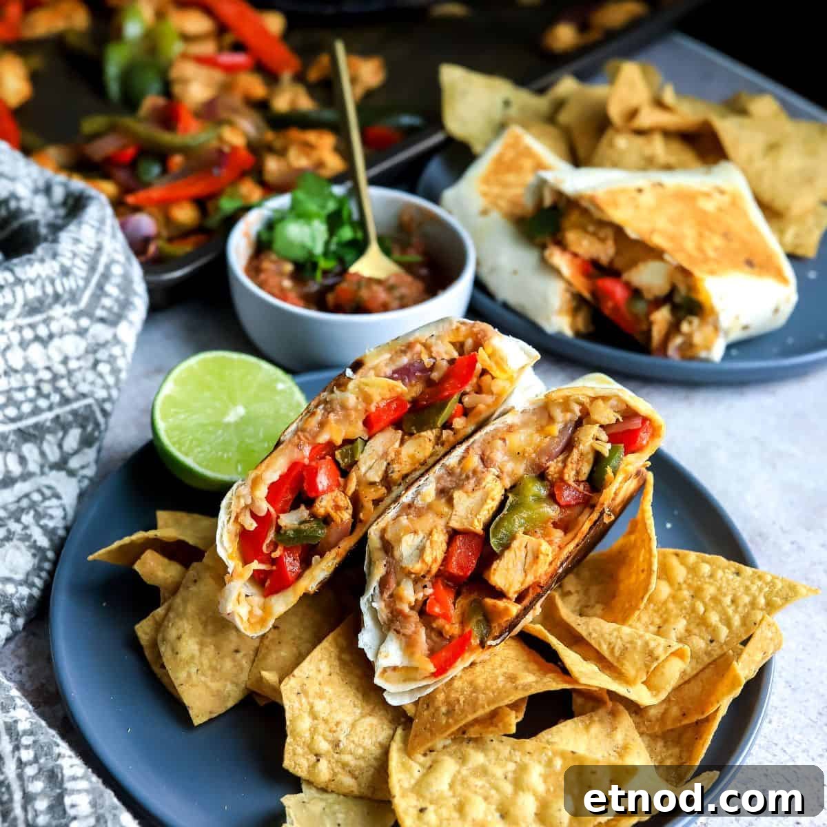 Wraps on a grey plate with tortilla chips.