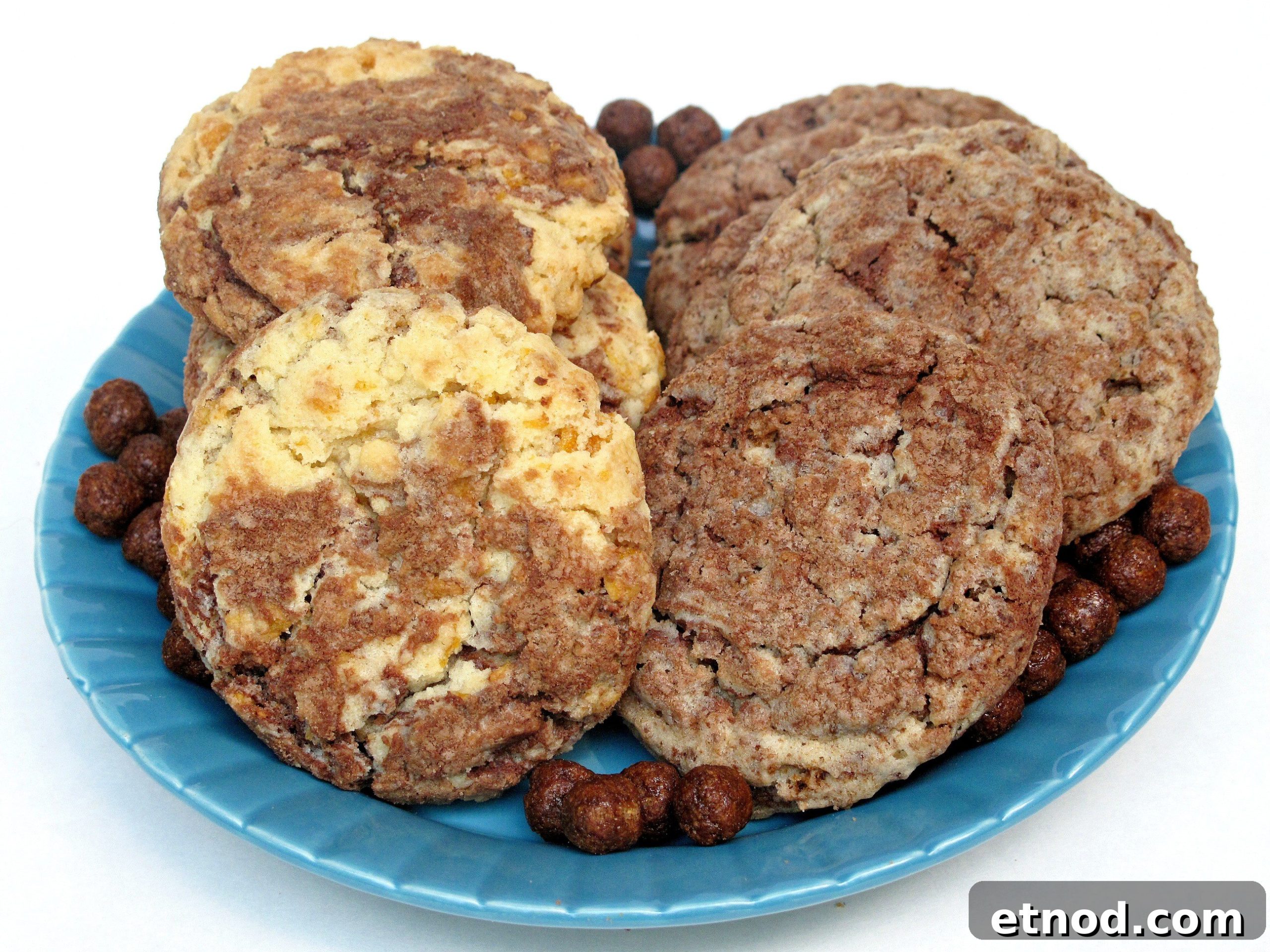 Special Order Cereal Cookies- Captain Crunch? Frosted Flakes? Cocoa Puffs? Customize these cookies with your favorite breakfast cereal! | The Monday Box Marbled Cereal Cookies with crackled tops on a serving plate.