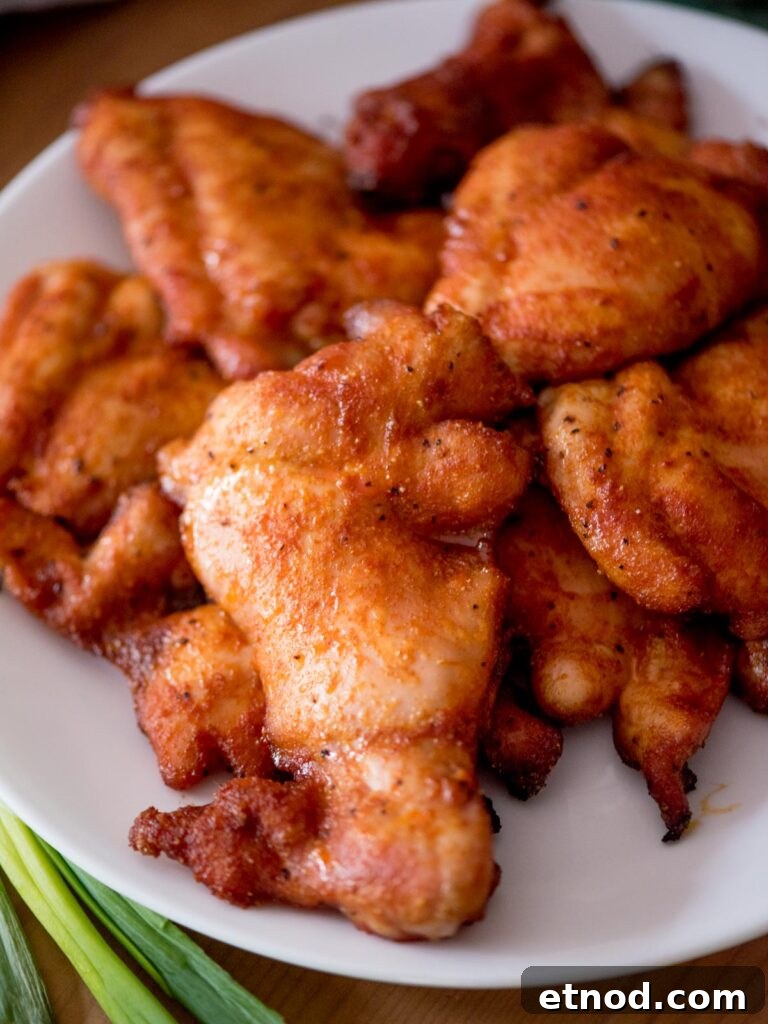 Juicy Chicken Thighs on a Pellet Grill: Flavorful Recipe Guide 7 Plate of smoked chicken thighs.