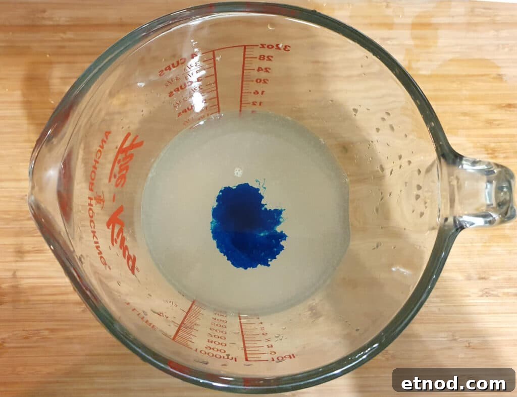 PJ Masks-Inspired Popsicle Recipes Kids Will Love 13 Adding blue colour to lemonade mix
