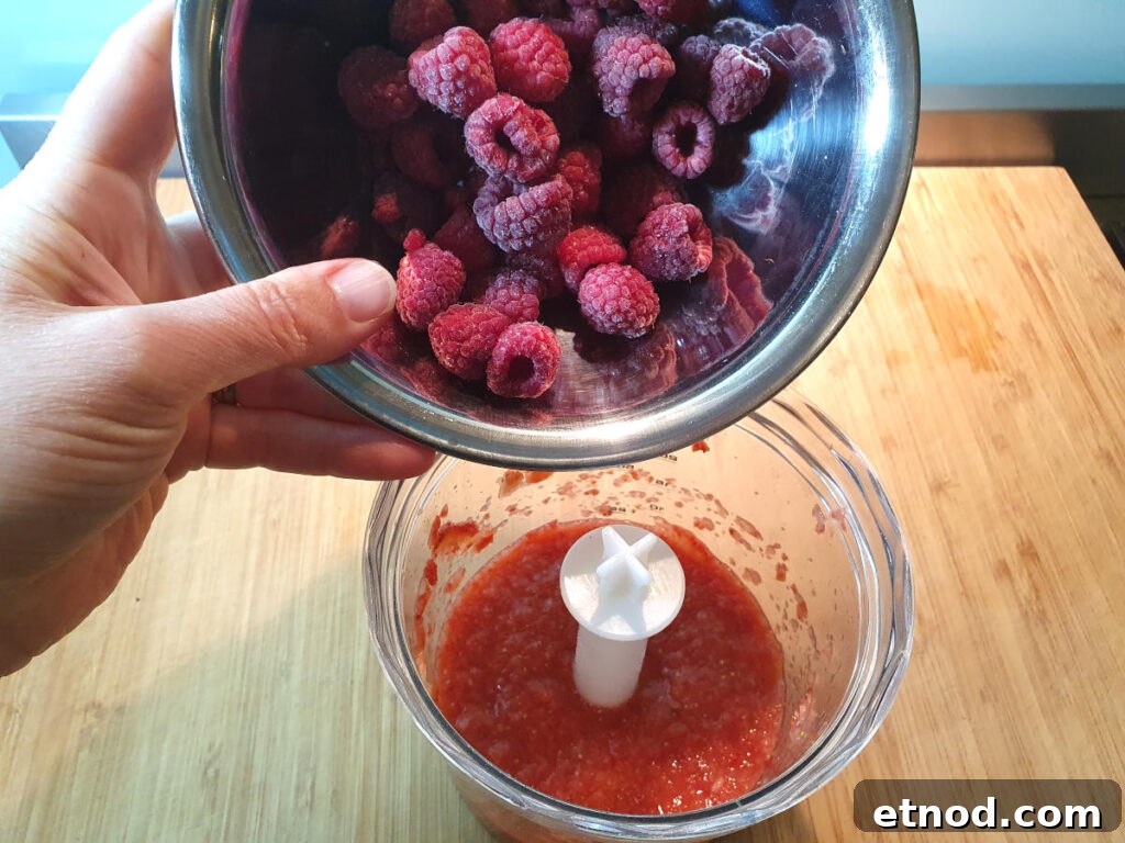 PJ Masks-Inspired Popsicle Recipes Kids Will Love 5 Adding raspberries to blended strawberries