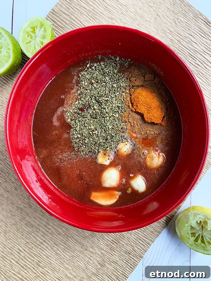 Crispy Instant Pot Carnitas Recipe for Authentic Mexican Flavor 5 Carnitas ingredients in a red bowl.
