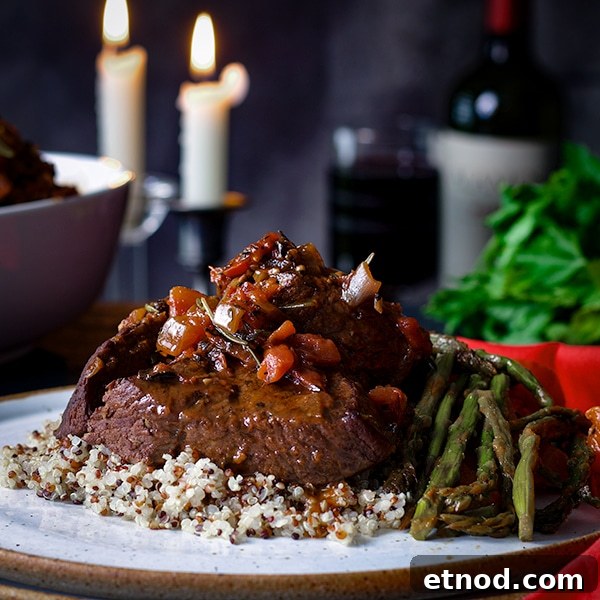 Rosemary-Braised Steak Tips Over Fluffy Quinoa Bowl 3 Rosemary Braised Steak Tips with Quinoa and sautéed asparagus and red bell peppers.