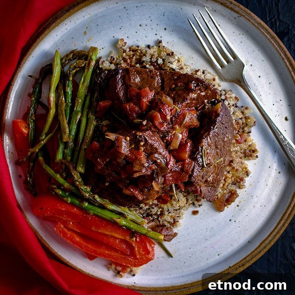 Rosemary-Braised Steak Tips Over Fluffy Quinoa Bowl 5 Rosemary Braised Steak Tips with Quinoa and sautéed asparagus and red bell peppers.
