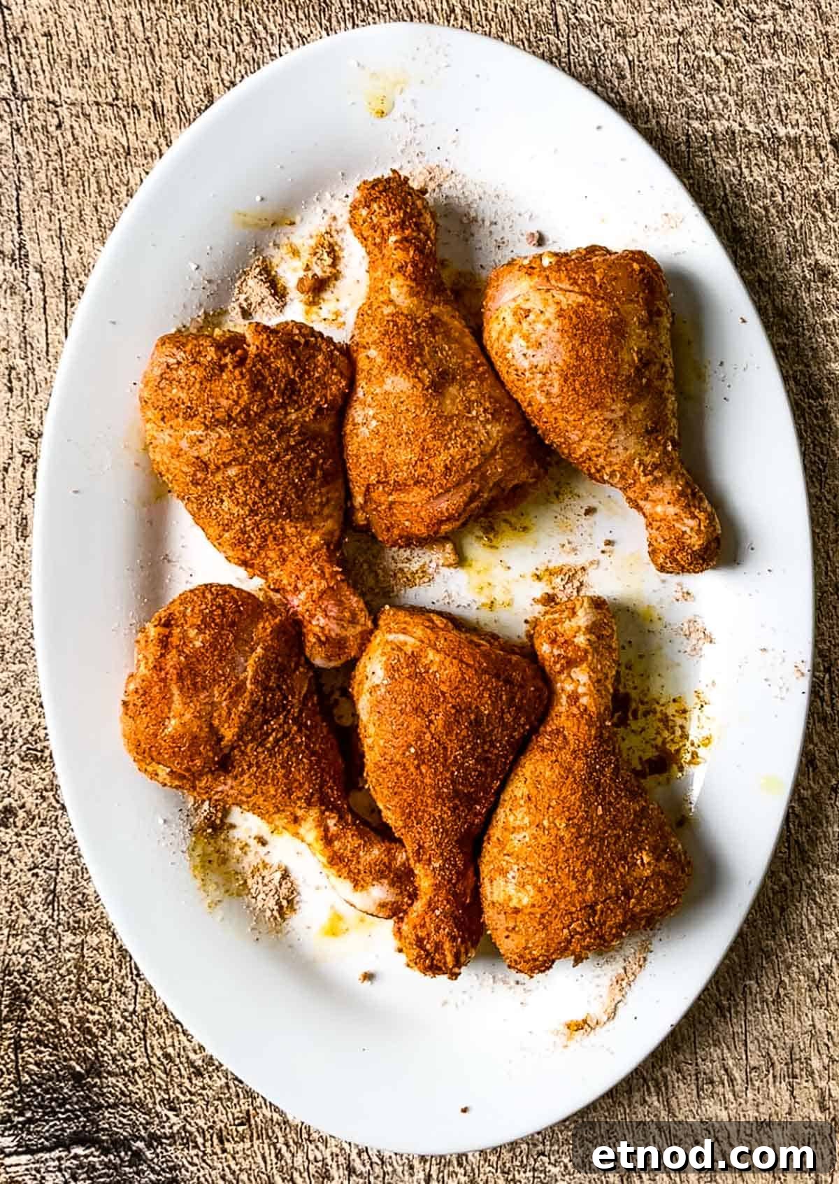 Crispy Air Fryer Chicken Drumsticks — Quick Weeknight Recipe 9 Chicken legs covered in the spice rub.