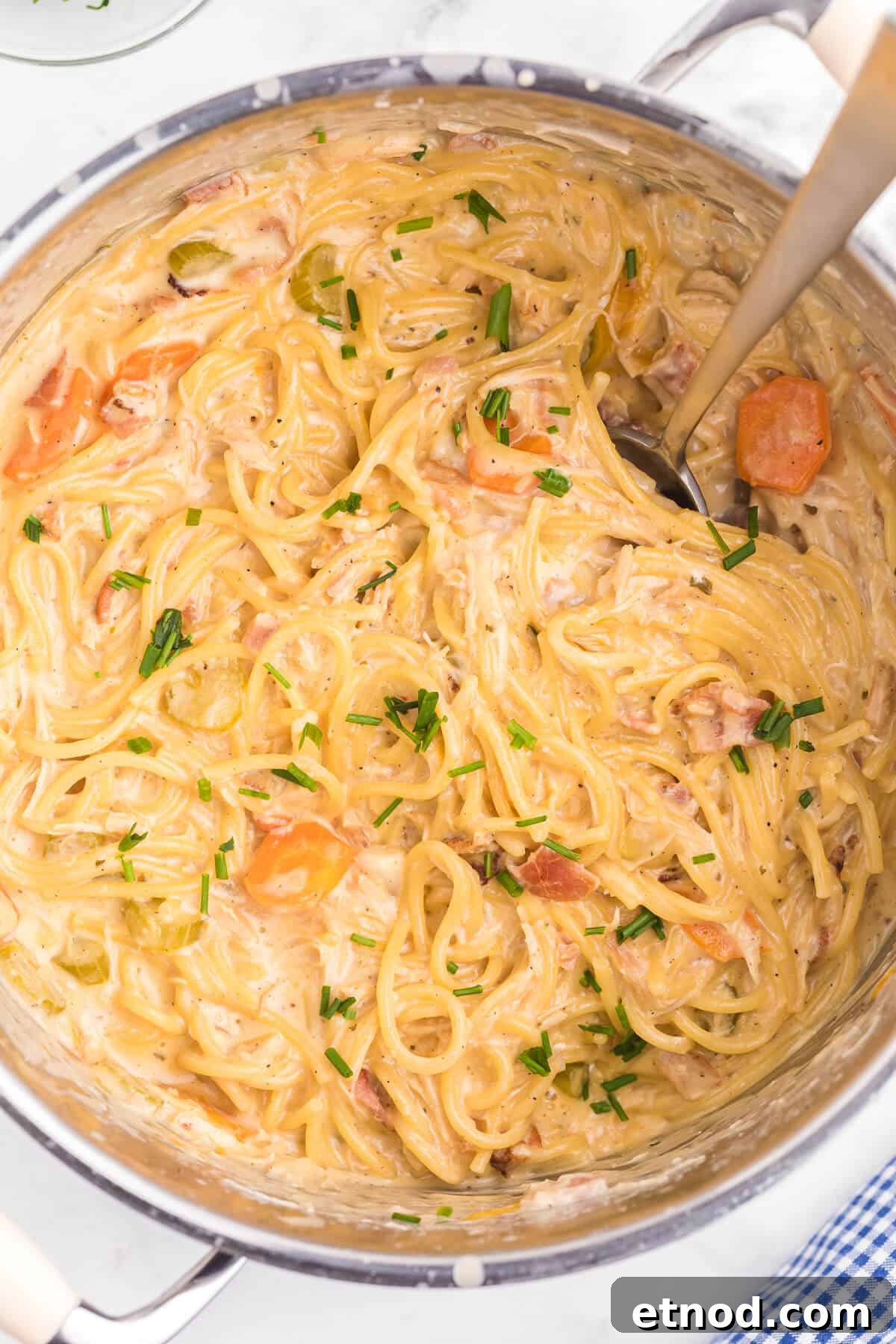 Crack Chicken Spaghetti Recipe - One bite and you'll be hooked! This easy and delicious dinner recipe is creamy, cheesy and addictive. It's loaded with chicken, bacon, veggies and spaghetti noodles in a flavorful cream cheese based sauce.