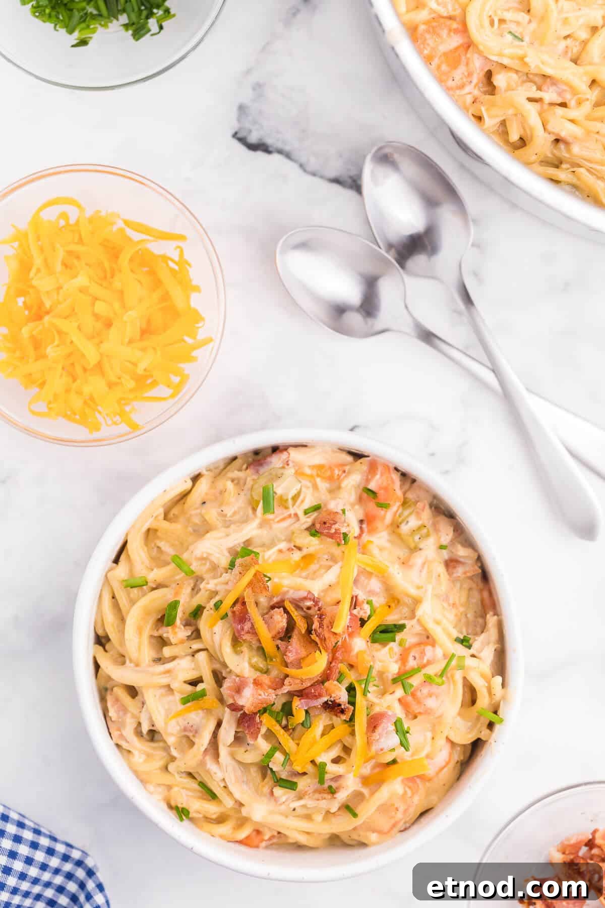 Crack Chicken Spaghetti Recipe - One bite and you'll be hooked! This easy and delicious dinner recipe is creamy, cheesy and addictive. It's loaded with chicken, bacon, veggies and spaghetti noodles in a flavorful cream cheese based sauce.