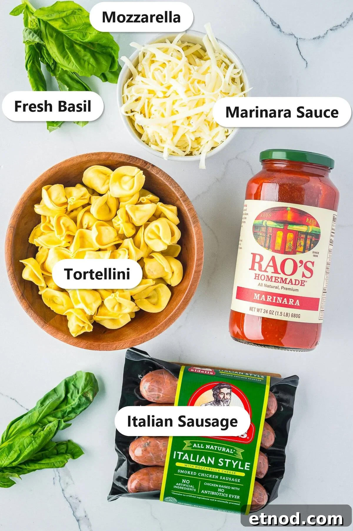 Creamy Italian Sausage Tortellini Bake: Cheesy Oven Pasta Delight 3 Labeled ingredients for sausage tortellini bake including fresh tortellini, Italian sausage, marinara sauce, mozzarella, and fresh basil.