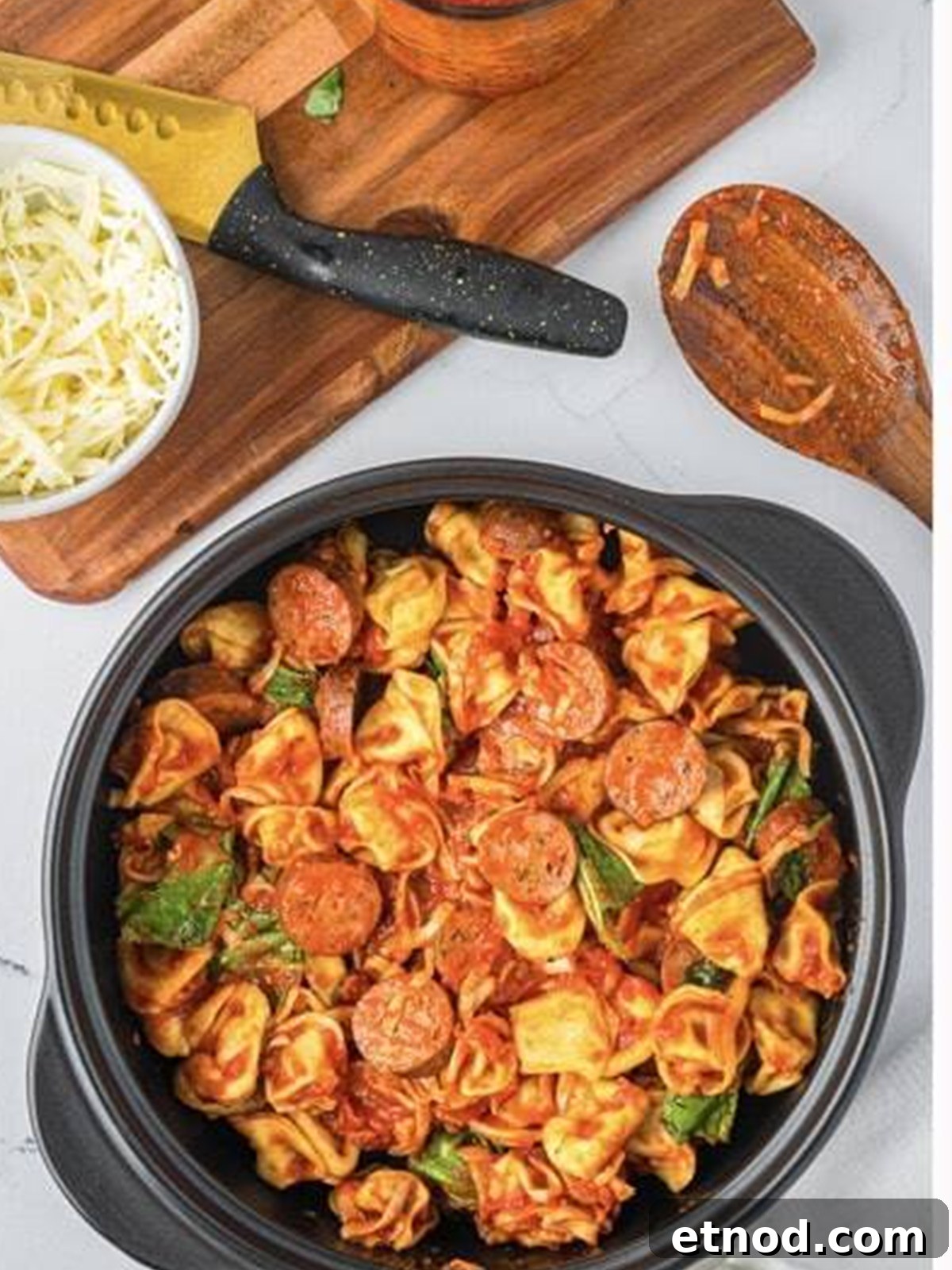 Creamy Italian Sausage Tortellini Bake: Cheesy Oven Pasta Delight 7 Sausage tortellini mixture poured into the baking dish before going into the oven.