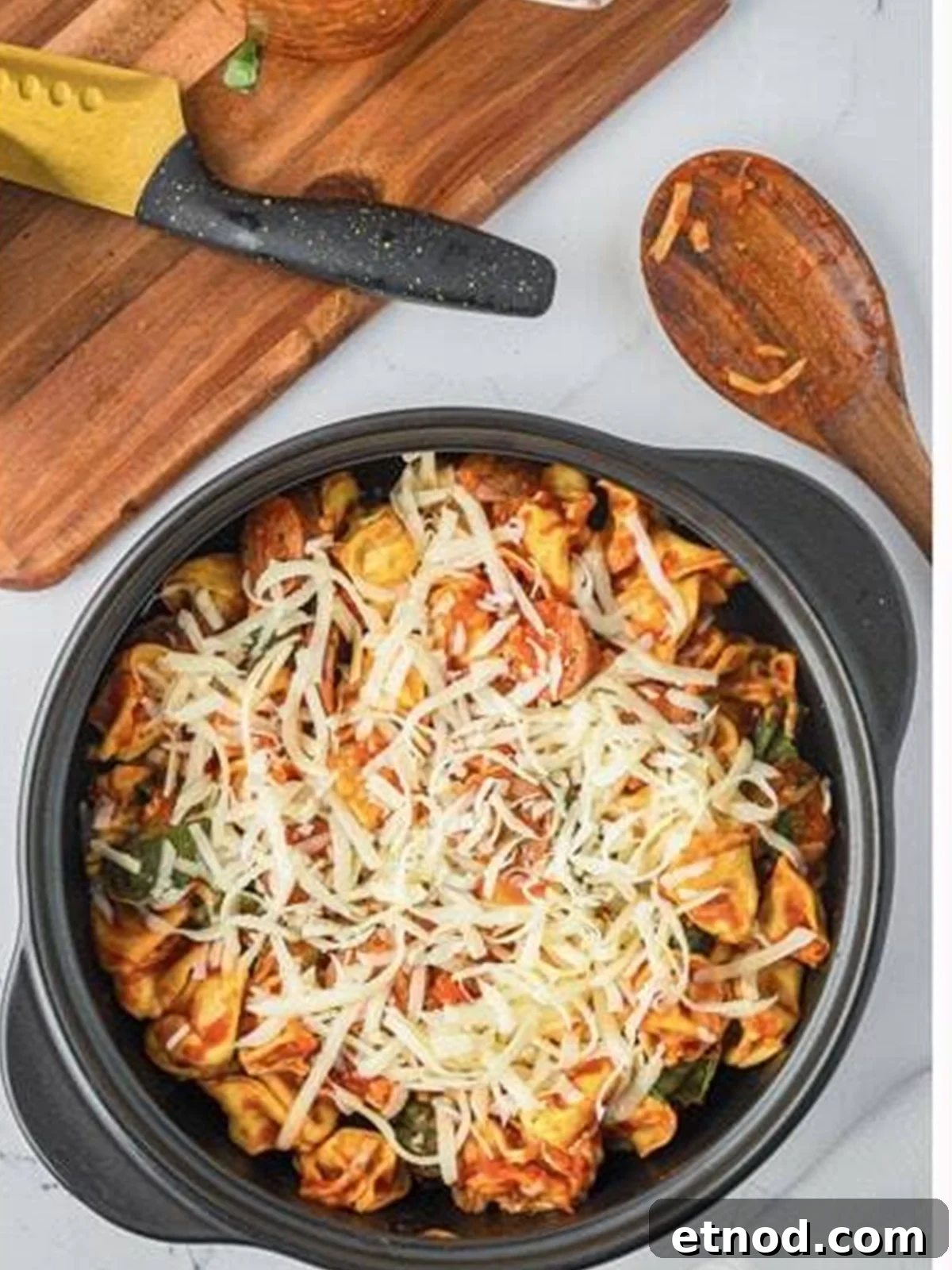 Creamy Italian Sausage Tortellini Bake: Cheesy Oven Pasta Delight 8 Shredded mozzarella sprinkled over the baked tortellini and sausage.