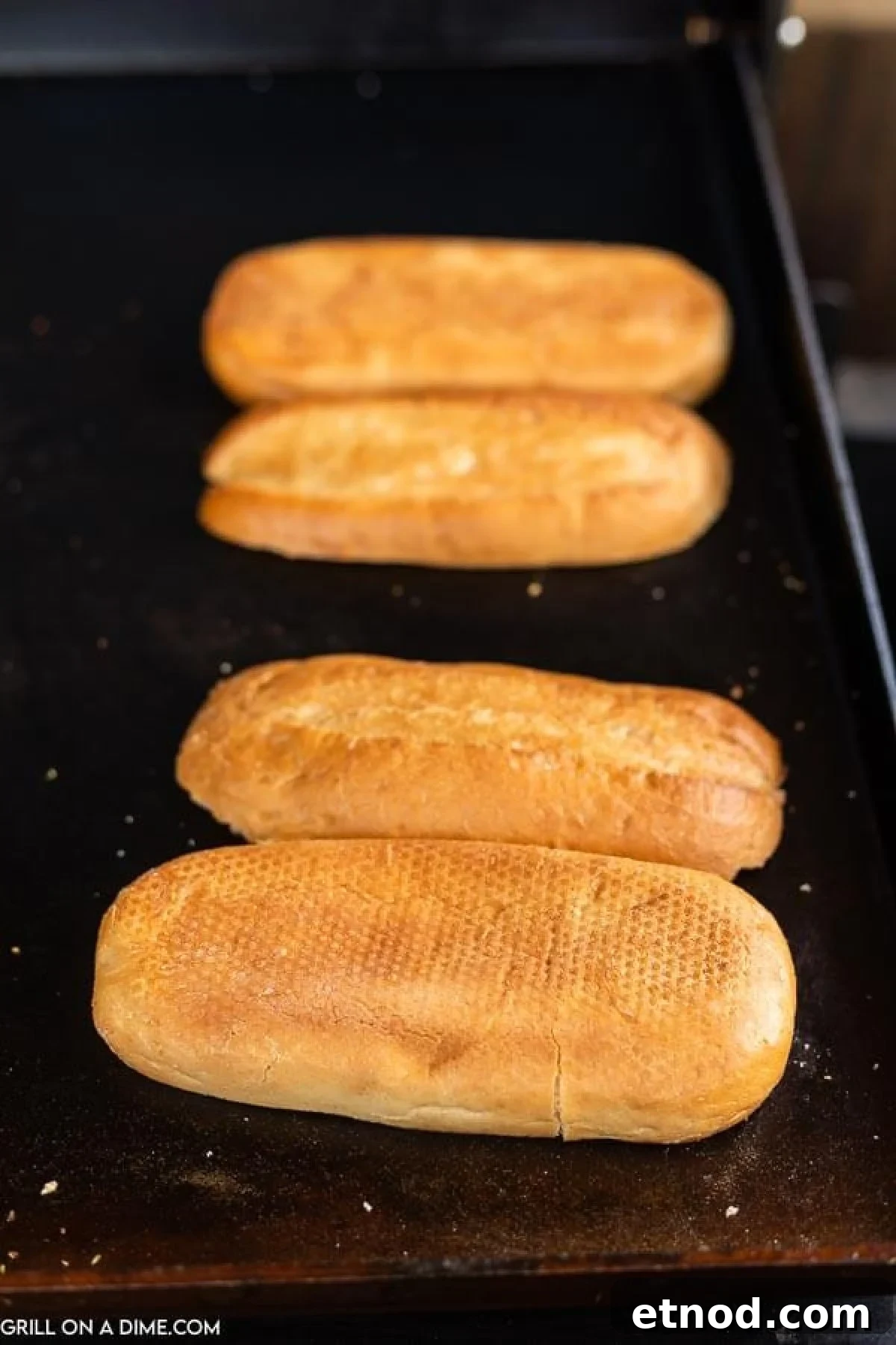 Blackstone Philly Cheesesteak Chicken Sandwich Recipe 5 Toasting the hoagies on the griddle.