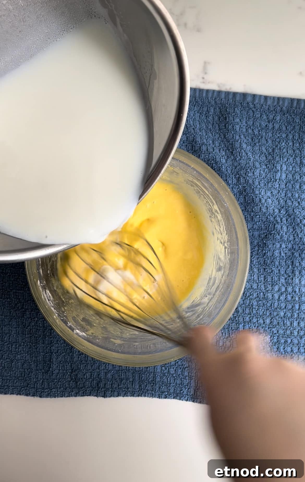 Vanilla and Raspberry Pancake Layer Cake Recipe 15 The process of tempering eggs when making pastry cream.