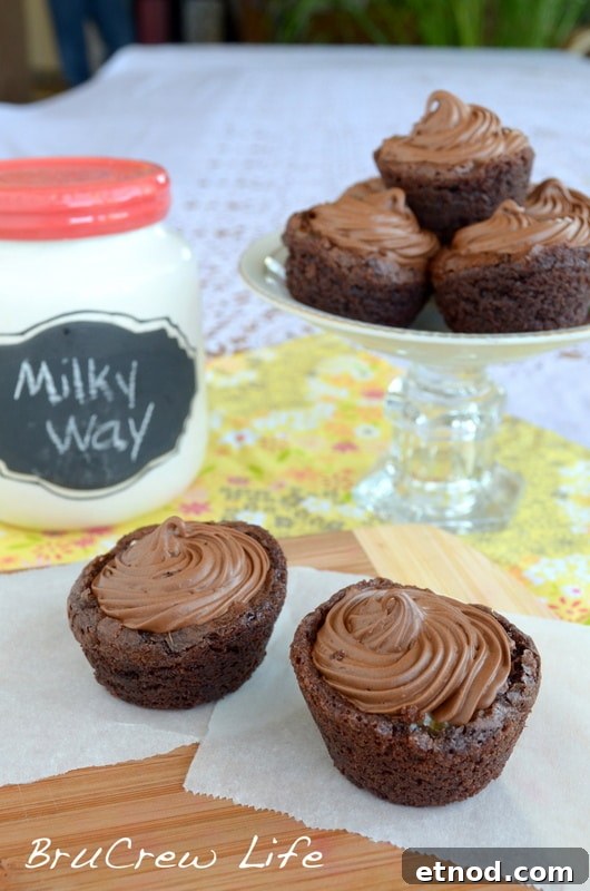 Milky Way Brownie Cups - these sweet little cups are made with just 4 ingredients! Perfect treat for your sweet tooth! 4 ingredients is all you need to make these decadent brownie bites.