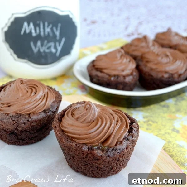 Milky Way Brownie Cups - Caramel centers and whipped chocolate make these little Milky Way Brownie Cups a fun surprise treat. Caramel centers and whipped chocolate make these little Milky Way Brownie Cups a fun surprise treat.