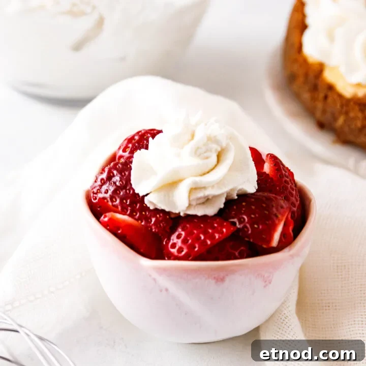 Serving suggestion image showing a bowl of strawberries with whipped cream.