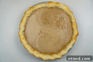 Pouring the mixture into the crust