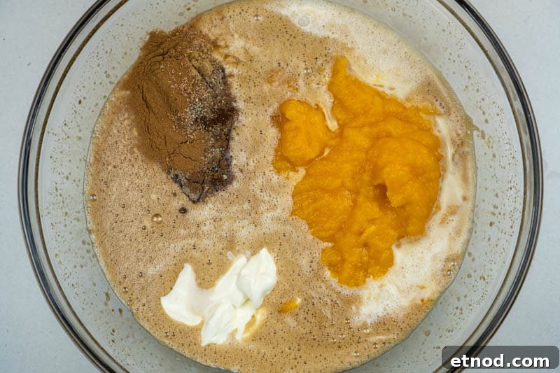 Adding the dairy, spices & pumpkin puree