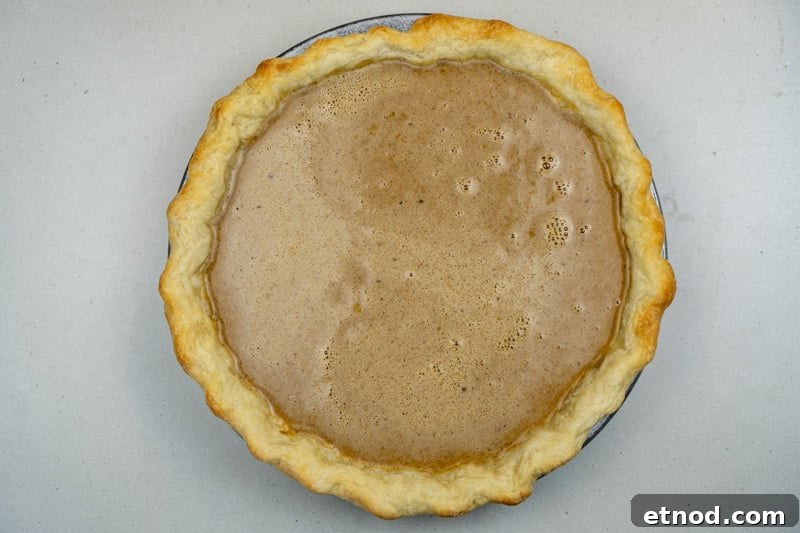 Pouring the mixture into the crust