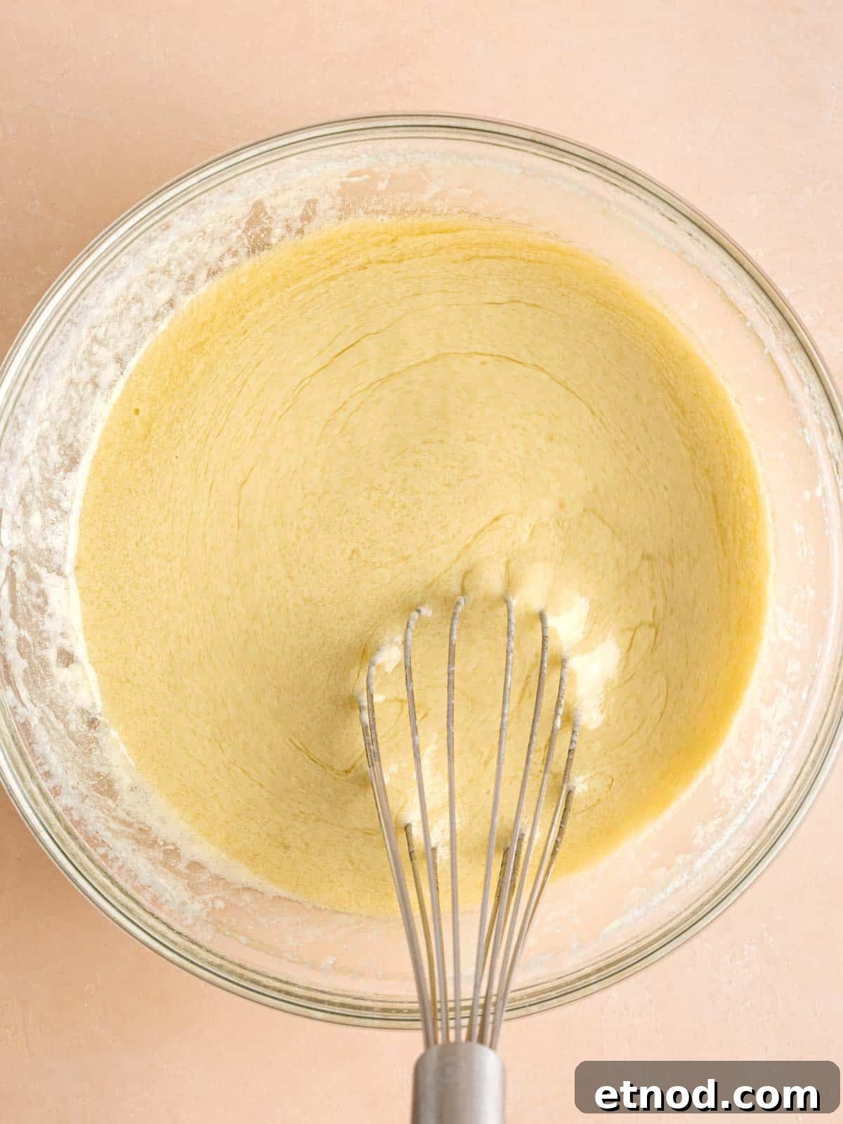 Matcha Muffins with White Chocolate Chips: Soft & Moist Recipe 5 Whisking matcha kefir, vegetable oil, egg, and vanilla extract in a bowl.