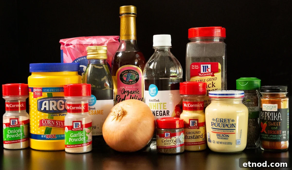 Subway Sweet Onion Sauce: Flavor, Ingredients & How It's Made 4 All the ingredients to make sweet onion sauce on a black background. Sugar, spice bottles, vinegar bottles, a sweet onion, mustard, and cornstarch.