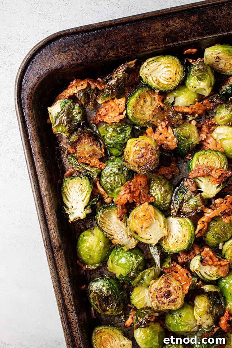 Oven-Roasted Keto Brussels Sprouts Recipe 2 overhead view of keto oven roasted brussel sprouts on a metal sheet pan