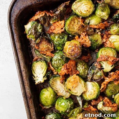 Oven-Roasted Keto Brussels Sprouts Recipe 12 overhead view of keto oven roasted brussel sprouts on a metal sheet pan