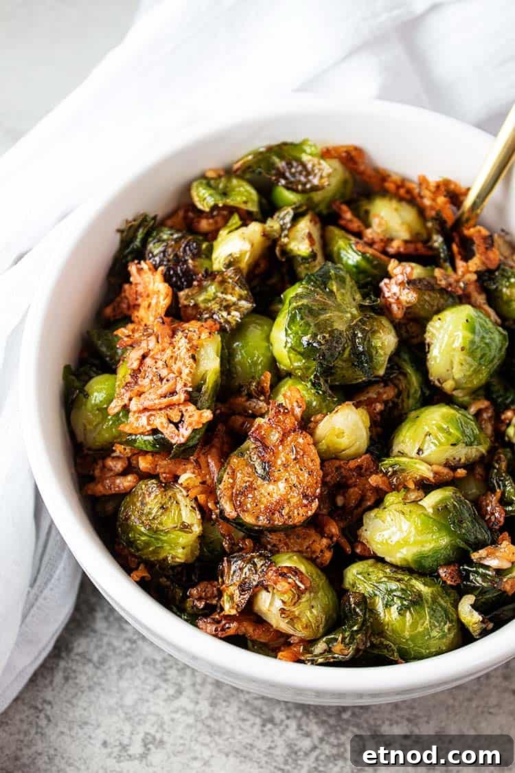 Oven-Roasted Keto Brussels Sprouts Recipe 7 overhead view of keto oven roasted brussel sprouts in white serving bowl