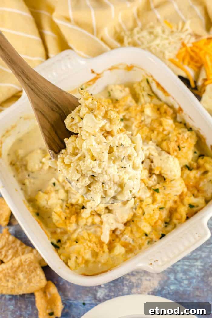 Oven-Roasted Keto Brussels Sprouts Recipe 9 wooden spoon with part of keto cauliflower mac and cheese on it