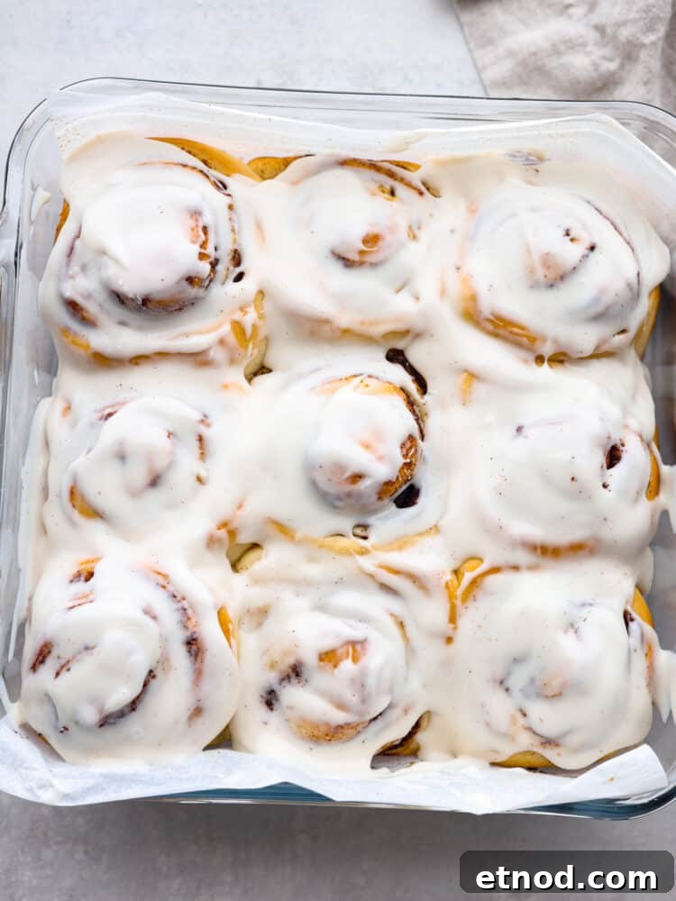 45-minute cinnamon rolls, glazed The top view of 45-minute cinnamon rolls, baked and in a pan with a glaze on top.