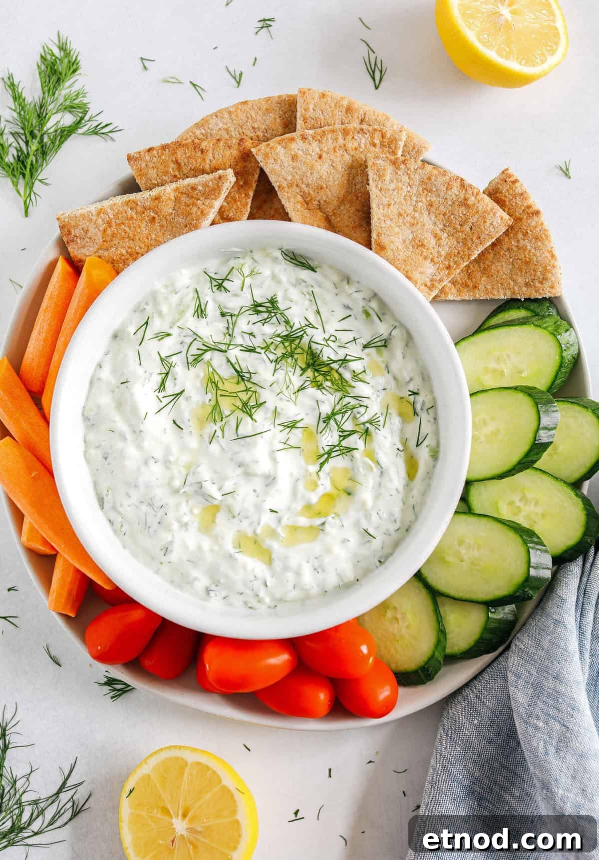 Authentic Homemade Tzatziki Recipe for Creamy Greek Sauce 2 Fresh and flavorful Homemade Tzatziki Sauce is a creamy yogurt-based sauce perfect for the summer served with kabobs, grilled veggies, pita bread and more! This recipe is easily made in just 5 minutes with a few simple ingredients!