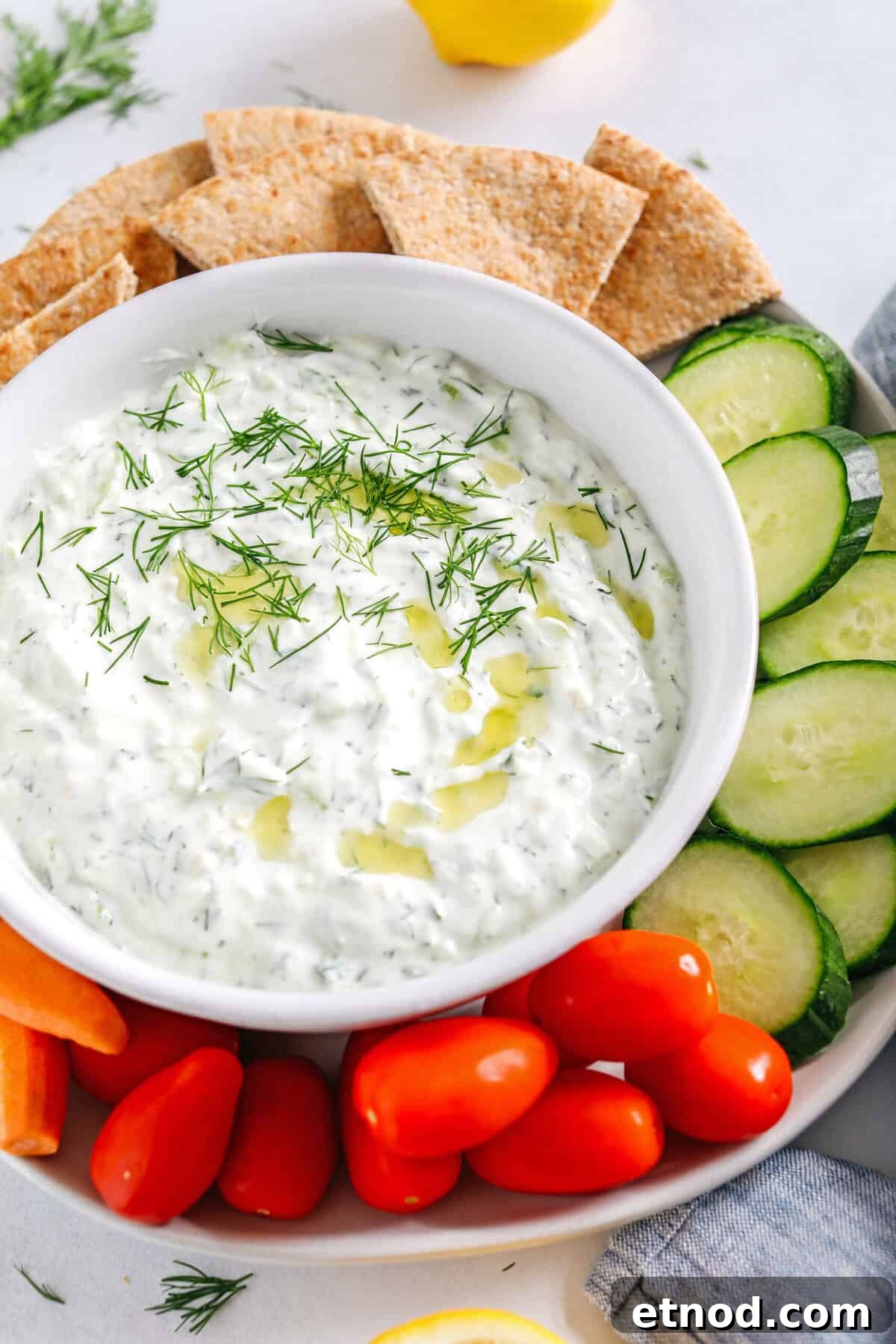 Authentic Homemade Tzatziki Recipe for Creamy Greek Sauce 4 Fresh and flavorful Homemade Tzatziki Sauce is a creamy yogurt-based sauce perfect for the summer served with kabobs, grilled veggies, pita bread and more! This recipe is easily made in just 5 minutes with a few simple ingredients!